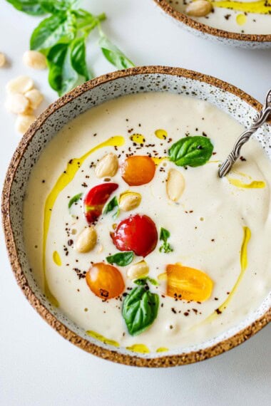 Ajo Blanco (White Gazpacho) is a delicious summery treat. It's a Spanish cold soup made with bread, Marcona almonds, garlic, and sherry vinegar in just 10 minutes. Serve it as a soup or as an appetizer! Vegan.