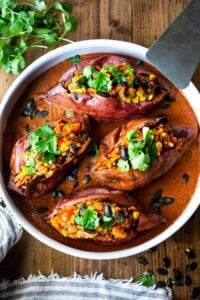 Stuffed Baked Potato with blackbeans and veggies and Mexican spices.