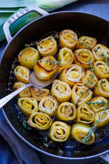 These tender braised leeks are a delicious, easy, flavorful vegetable side that just melts in your mouth. Made with simple ingredients, they are vegan and gluten-free.