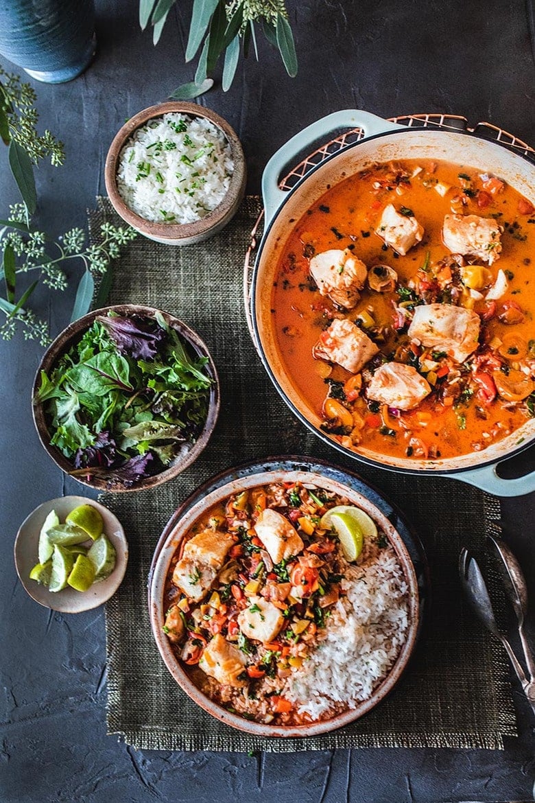 A simple Brazilian Fish Stew called Moqueca made with your choice of fish, simmered in coconut milk with onion, tomatoes, chilies and lime. Easy, fast and full of flavor! Serve this with rice! #Moqueca #fishstew #brazilianfishstew