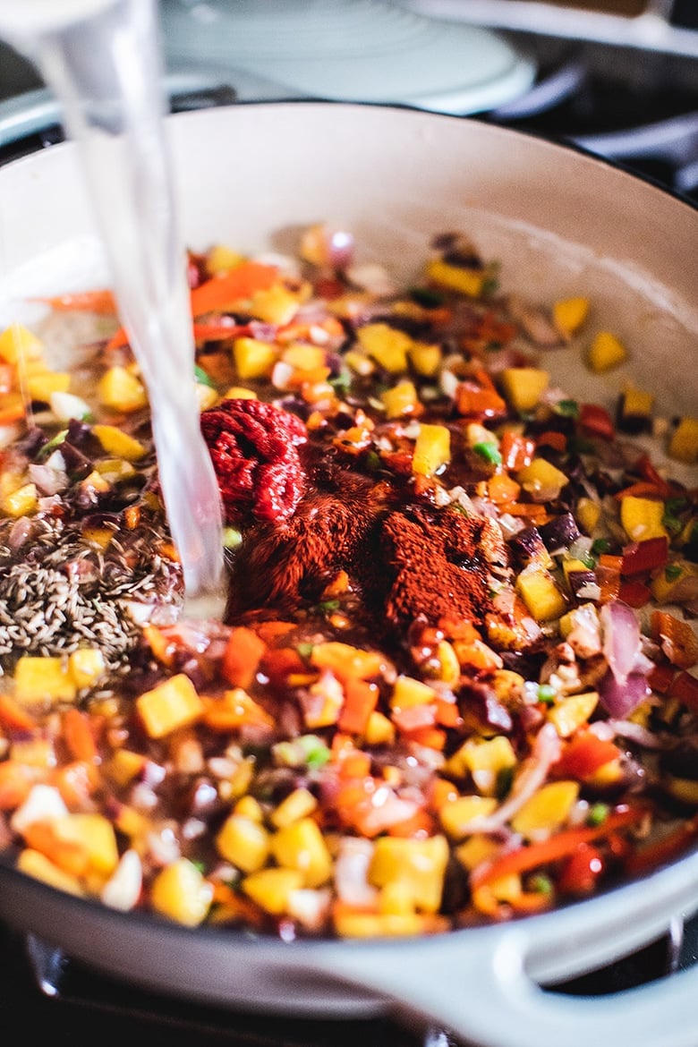 A simple Brazilian Fish Stew called Moqueca made with your choice of fish, simmered in coconut milk with onion, tomatoes, chilies and lime. Easy, fast and full of flavor! Serve this with rice! #Moqueca #fishstew #brazilianfishstew