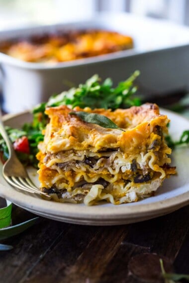 This Butternut Squash Lasagna recipe is a cozy and heartwarming vegetarian meal, made with a creamy roasted butternut squash sauce, no-boil noodles, mushrooms, spinach, ricotta, and crispy sage. Video + Vegan-adaptable.