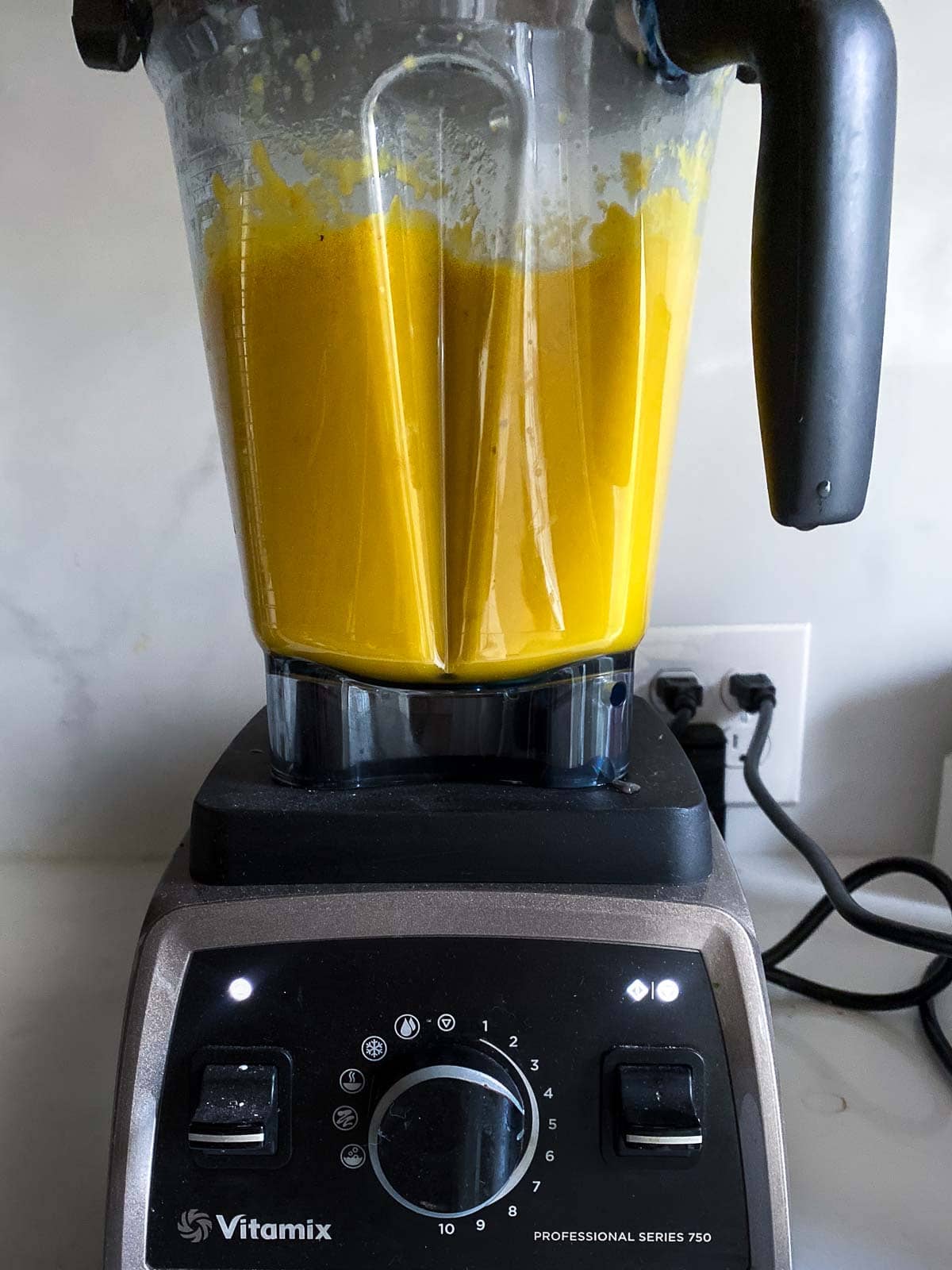 blended carrot soup in the blender