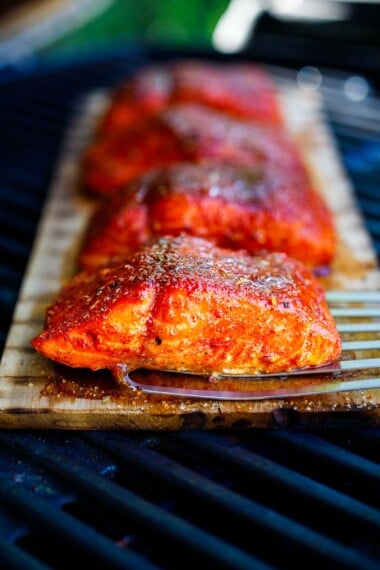 cedar plank salmon on a grill.