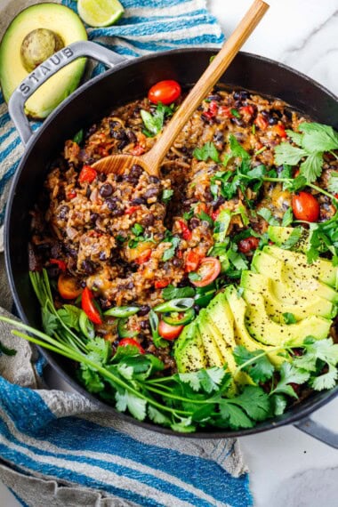 A quick weeknight skillet dinner - one-pan cheesy rice and black beans is ready in 30 minutes, made on the stovetop with the simplest ingredients. Vegan-adaptable, GF.