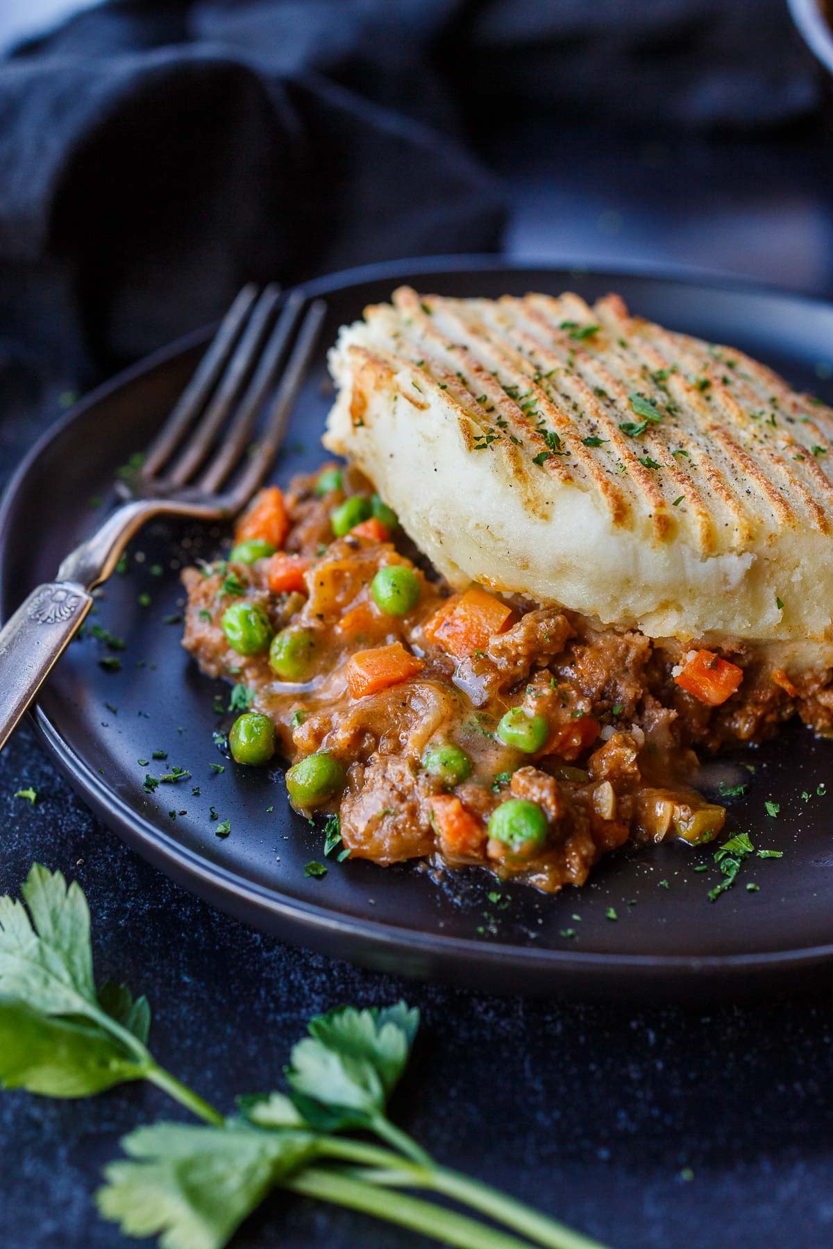 plate of cottage pie with veggie meat filling with mashed potato topping.
