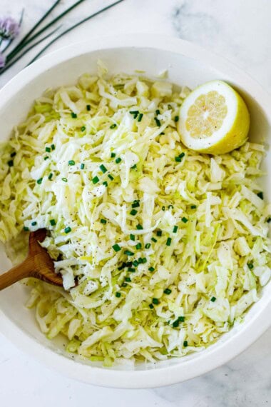 This creamy coleslaw recipe is irresistibly lemony and tangy. It's made with simple ingredients: cabbage, lemons, mayo, salt, and celery seeds. Vegan-adaptable and Gluten free.