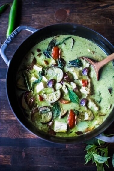 An easy authentic recipe for Thai Green Curry with eggplant and your choice of tofu, chicken or shrimp. A fast and easy weeknight dinner that can be made in 30 minutes! Use store-bought green curry paste or make your own homemade green curry paste.