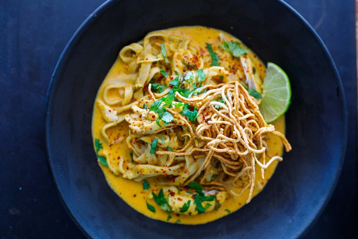 This Khao Soi recipe is rich, fragrant, and delicious! It's a Coconut Curry Noodle Soup that hails from Northern Thailand and can be made with chicken, shrimp, tofu, or our crispy tofu. Vegan-adaptable, GF.