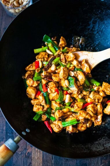 Learn how to make authentic Kung Pao Chicken! Tender chicken breast is stir-fried with the most flavorful Kung Pao Sauce. Serve with fluffy Jasmine rice, for a fast, easy weeknight dinner!