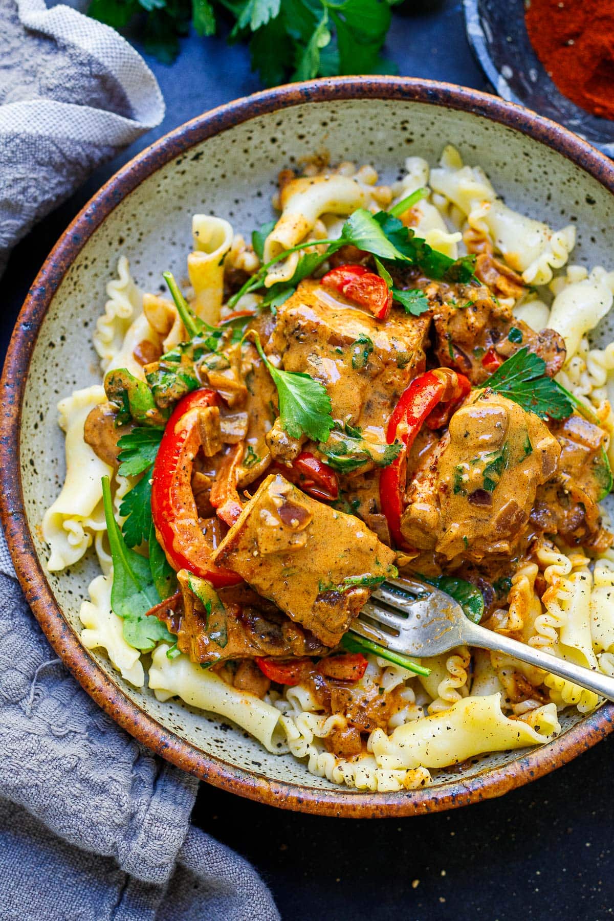 Best vegan dinner idea: Tofu paprikash in a bowl over noodles.