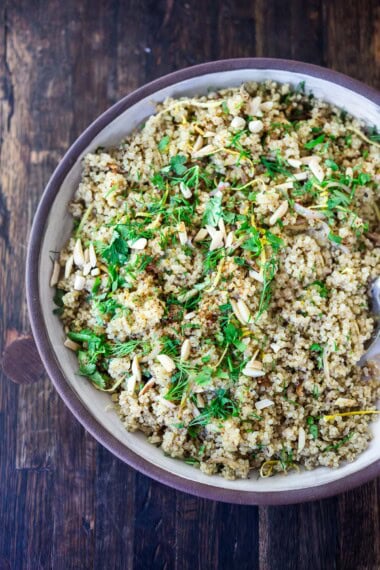 Learn how to cook perfect fluffy quinoa every time! Use in bowls, salads, wraps, or make our herby quinoa side dish. Vegan & gluten-free.