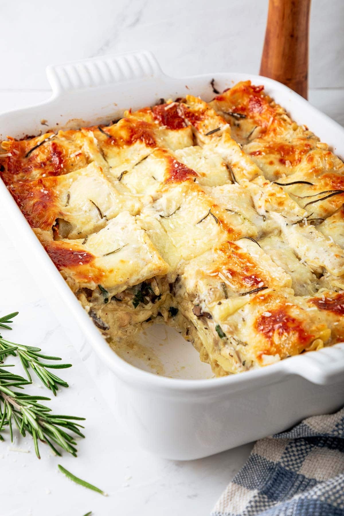 A delicious, cozy recipe for Rosemary Chicken Lasagna with mushrooms and spinach in a creamy Béchamel Sauce. A hearty meal perfect for special gatherings or Sunday supper. Vegetarian-adaptable. Video!