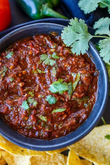 Authentic salsa roja recipe made with charred tomatoes, onions and garlic and dreid mexican chiles.