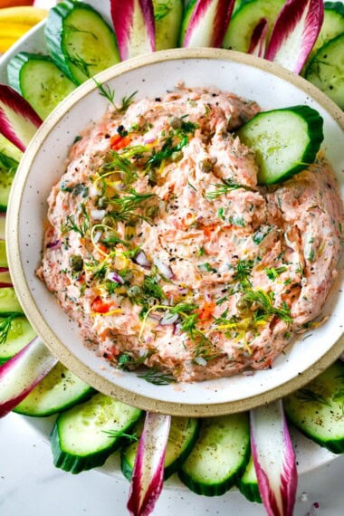 This smoked salmon dip is rich, creamy, and full of bright, briny, zesty flavor! Made with extra smoked salmon, plenty of fresh dill, cream cheese, tangy yogurt, green onion, lemon zest, and capers, it strikes the perfect balance of flavors.