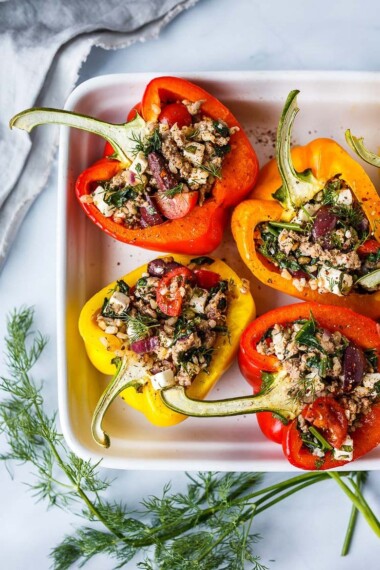 Mediterranean Stuffed Peppers in a baking dish.