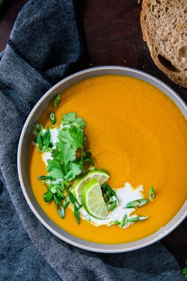 A healthy, Thai-inspired Sweet Potato Soup made with lemongrass, ginger, lime, and coconut milk. Creamy, comforting, flavorful-and fully vegan and gluten-free.