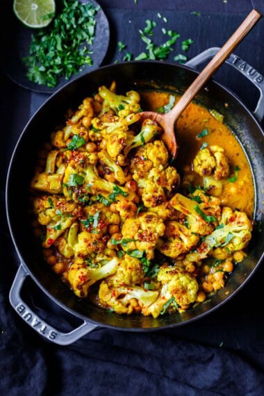 This easy, one-pan dinner is ready in 30 minutes! Cauliflower curry with chickpeas and coconut milk is a healthy, flavor-packed weeknight dinner. Vegan, Keto, Gluten-free.