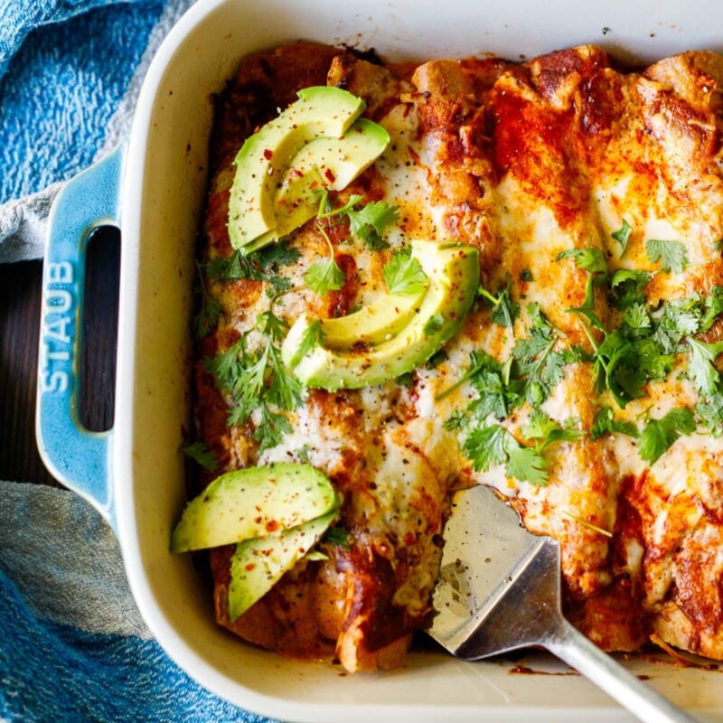 Vegetable enchiladas in a a blue baking dish